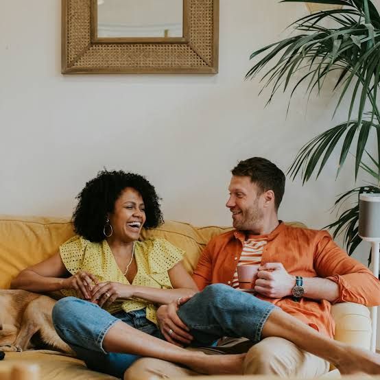 Happy married couple with different personalities enjoying quality time together, representing an introvert-extrovert relationship.