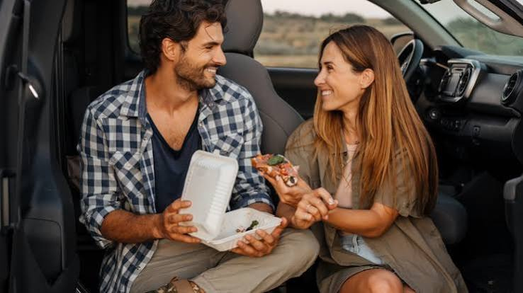 Romantic couple under a glowing zodiac sky symbolizing love, passion, and emotional connection.
