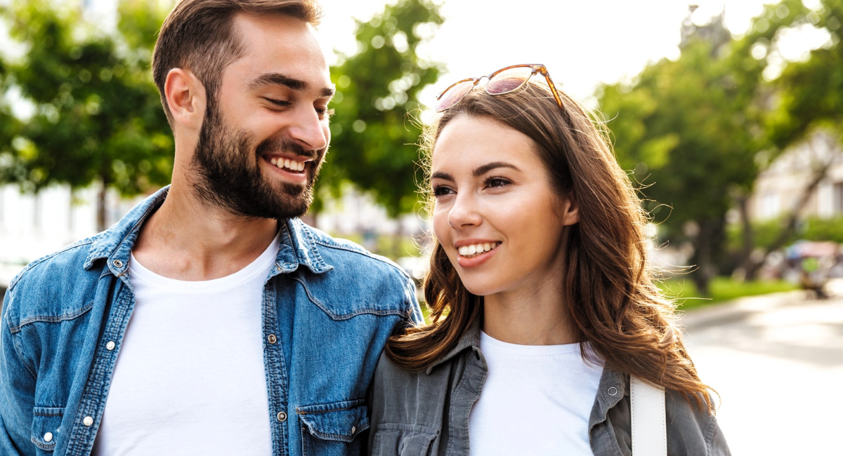 A smiling couple enjoying a video call while maintaining a healthy long-distance relationship through trust and communication.