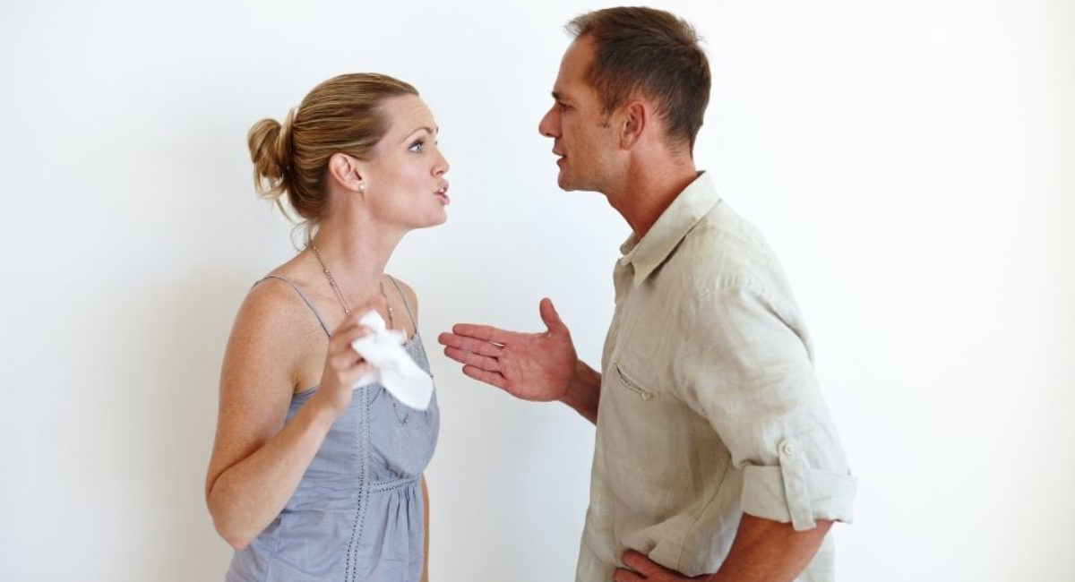 A couple calmly discussing their feelings during a conflict, practicing healthy communication and active listening to strengthen their relationship.