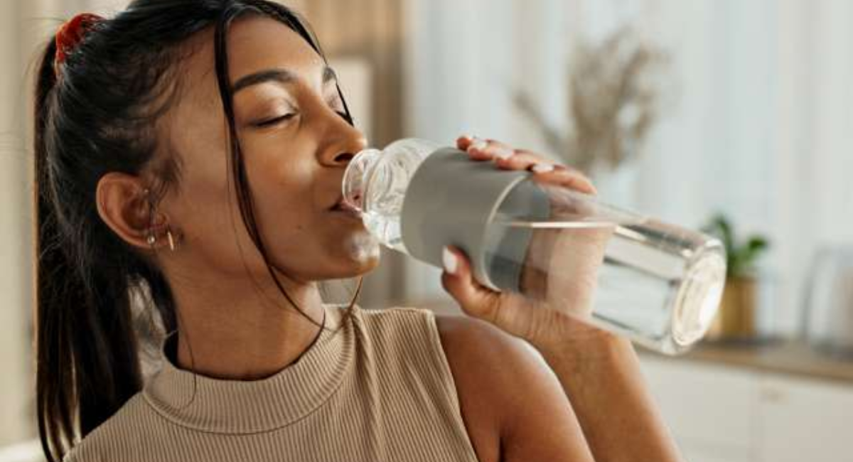 Colorful infographic showing hydration tips including drinking water first thing in the morning, carrying a reusable water bottle, eating water-rich foods, setting reminders, and recognizing signs of dehydration.