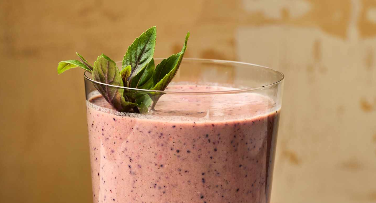 Five healthy weight loss smoothie recipes featuring pineapple, mango, strawberry, coconut, peach, Greek yogurt, chia seeds, and flax seeds.