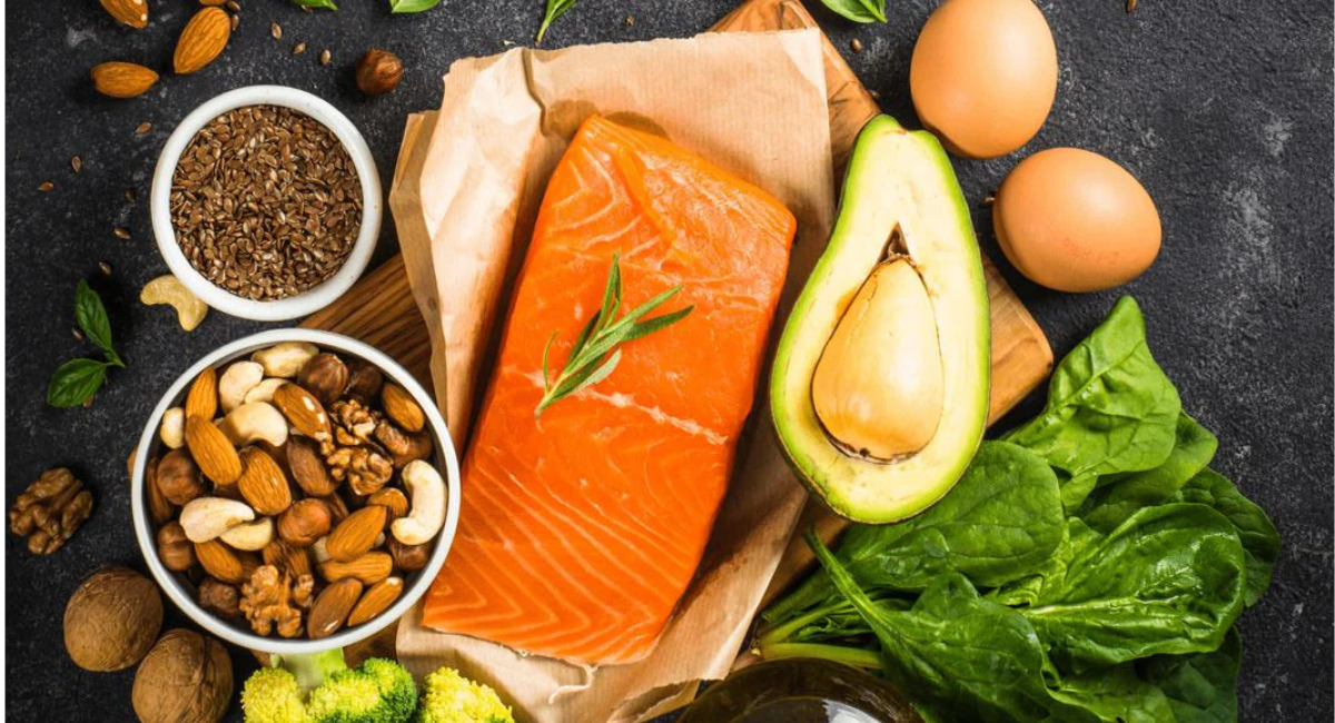 Healthy omega-3 foods featuring salmon, sardines, mackerel, walnuts, chia seeds, flaxseeds, hemp seeds, soybeans, oysters, and seaweed.