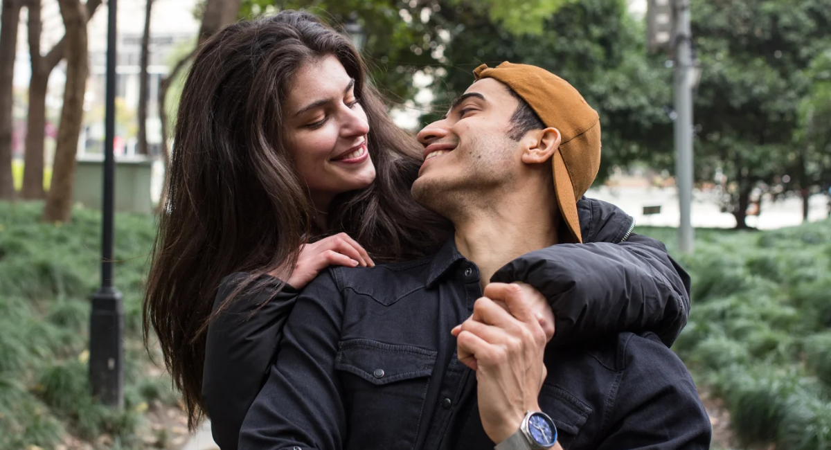 A happy couple smiling while enjoying quality time together and practicing healthy relationship habits that strengthen their bond.